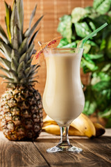 Pina Colada over wooden background