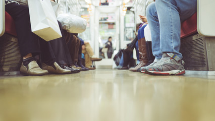 people feet in the subway commuter - obrazy, fototapety, plakaty