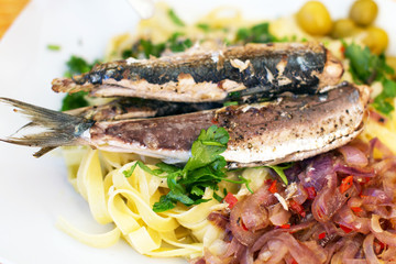Dish of fish with spaghetti