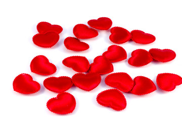 Several small red hearts tissue on a white background