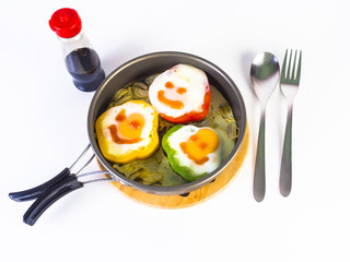 omelet on colorful peppers on pan