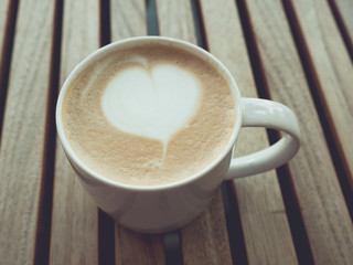 Cappuccino coffee with retro vintage style filter effect