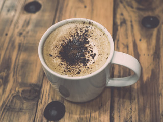 Cappuccino coffee with retro vintage style filter effect