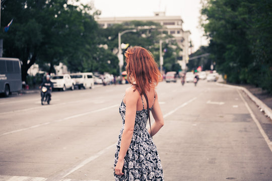 Young woman walking in Manila
