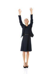 Businesswoman holding hands up