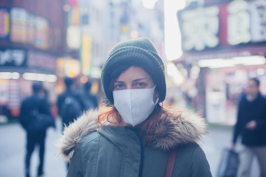 Young Woman With Face Mask In Japan