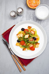fresh vegetable salad with mozzarella on grey