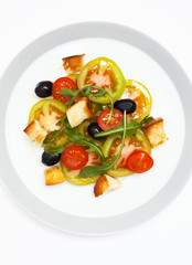 fresh vegetable salad with mozzarella on grey
