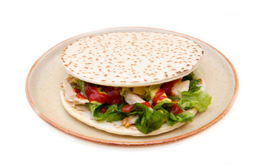 Flatbread with chicken and salad on white background