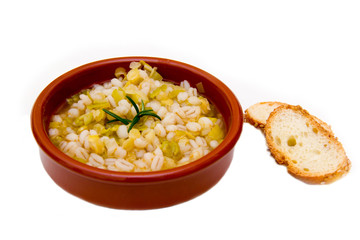 Spelled soup and vegetables on white background