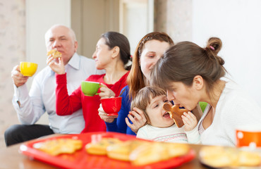  multigeneration family communicate over tea