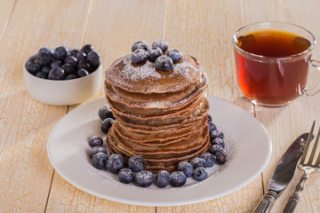 Homemade chocolate pancakes with berries