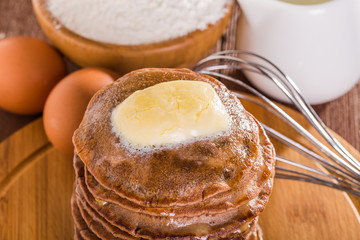 Homemade chocolate pancakes with butter