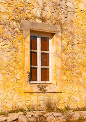 Fototapeta na wymiar window of an old house in Peleta village in southern Greece