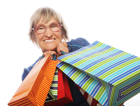 Happy Senior Woman With Shopping Bags