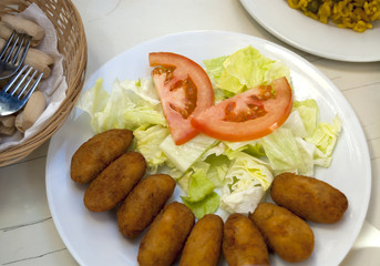 Bowl of croquettes and salad