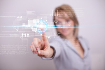 Young business woman touching future web technology buttons and