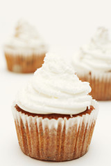 Chocolate cupcakes with whipped cream. Shallow dof.