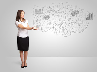 Obraz premium Business girl presenting hand drawn sketch graphs and charts