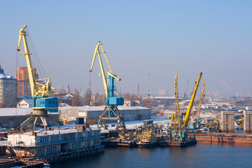 view to empty cargo dock with cranes and containers