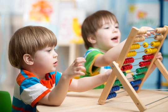 kids playing with abacus
