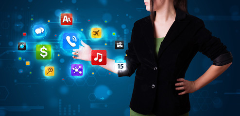 Woman pressing various collection of high tech buttons