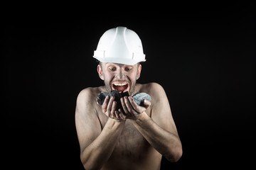 Coal miner on a black background