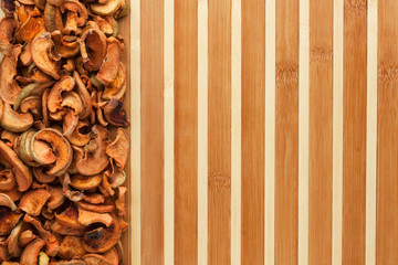 Dried apples on a bamboo mat