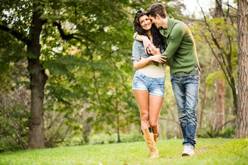 Fototapeta premium Young Couple Walking In The Park