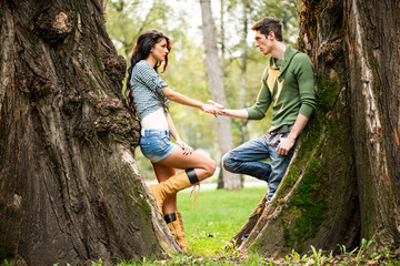 Romance Beside A Tree Trunk