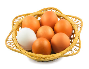 Eggs in a basket isolated on a white background