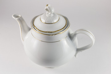 Porcelain teapot with gold border