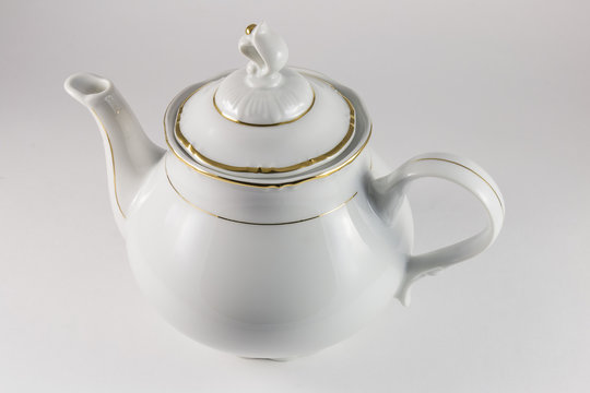 Porcelain teapot with gold border