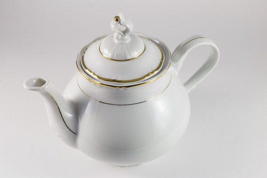 Porcelain teapot with gold border