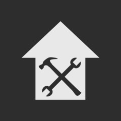 White house repair symbol on dark grey