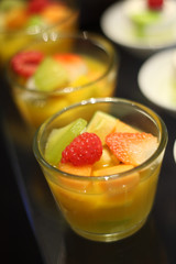 mixed fruits salad, dessert in buffet line.