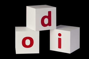 white cubes with letters isolated on black