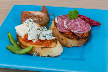 Tapas with cheese and salami