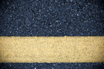 Fototapeta premium Yellow line on road texture