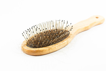 Hair Loss with comb on white background