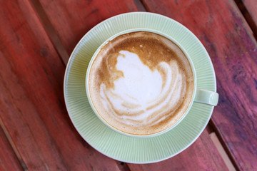 Coffee cup on red table