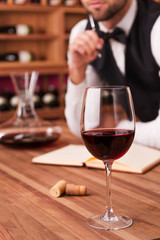 Writing notes about wine.