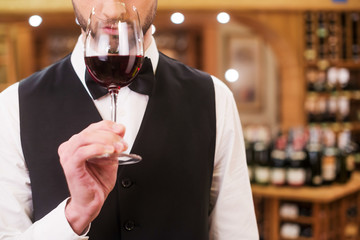 Confident and experienced sommelier.