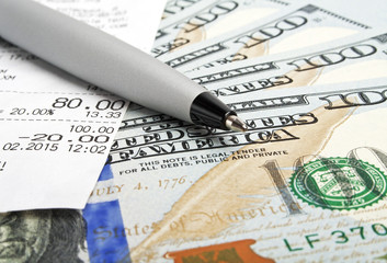 Business concept - money, pen and cash voucher