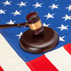 Judge gavel over US flag - closeup studio shot