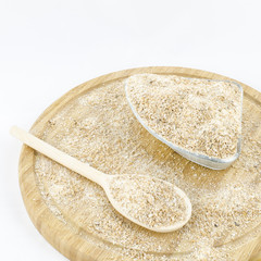 Wholemeal flour on wooden board. Healthy vegetarian food.