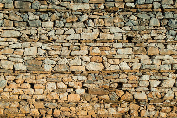 Stone wall in a traditional village of Greece