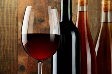 Composition with glass and bottles of wine