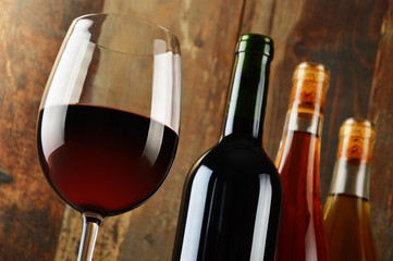 Composition with glass and bottles of wine