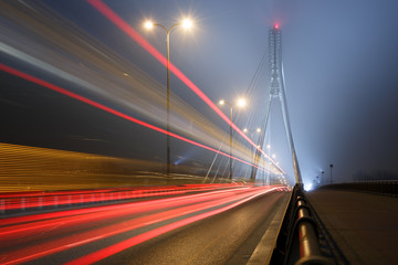 Fototapeta na wymiar Suspension bridge in the fog and speed lines. Bridge Swietokrzys
